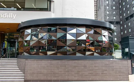 eclectic-building-refurbishment-with-facated-glass-appearance