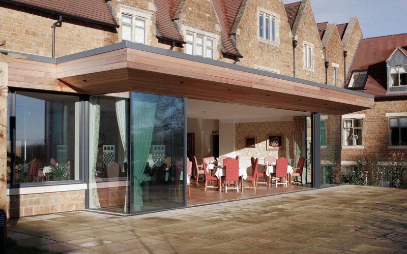 accessible sliding doors to the restaurant of a care home shown open in the middle